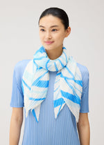 A model wears the PLEATS PLEASE ISSEY MIYAKE FOLD LINE SCARF fold-line-scarf-stole-charcoal.