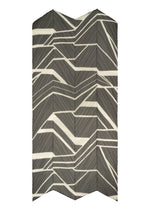 A detail shot of the PLEATS PLEASE ISSEY MIYAKE FOLD LINE SCARF stole.