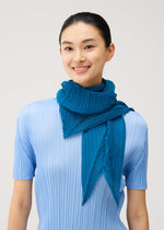 A model wears the PLEATS PLEASE ISSEY MIYAKE FOLD HOOD SCARF fold-hood-scarf-stole-navy.