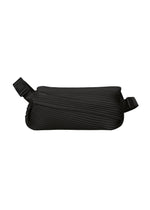 A product shot of the PLEATS PLEASE ISSEY MIYAKE BIAS PLEATS WAIST BAG bag in black.